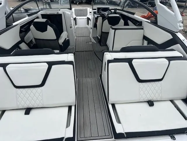 Slide: The Image of 2024 Yamaha Boats 252 S interior with sleek white seating and modern design. - 26