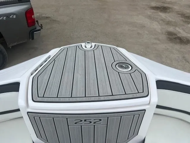 Slide: The Image of 2024 Yamaha Boats 252 S bow with sleek gray decking and modern design. - 7