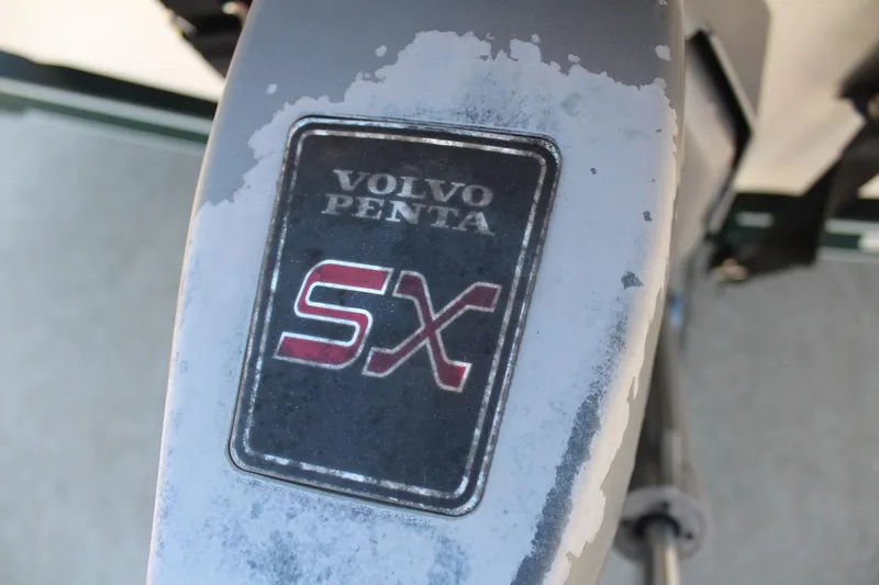 Slide: The Image of Volvo Penta SX outdrive on 2001 Glastron GX 185 boat, showing wear. - 13