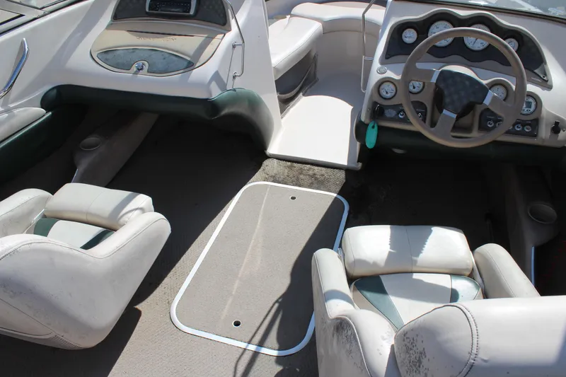 Slide: The Image of 2001 Glastron GX 185 boat interior with steering wheel and seating. - 16