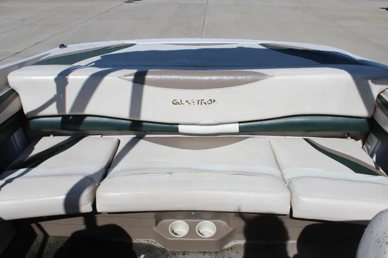 Slide: The Image of 2001 Glastron GX 185 boat interior with white and green seating. - 18