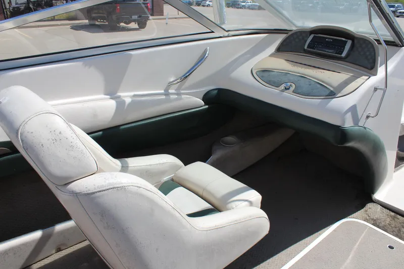 Slide: The Image of 2001 Glastron GX 185 boat interior with white and green seating. - 22