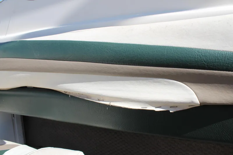 Slide: The Image of 2001 Glastron GX 185 boat interior with damaged upholstery. - 23