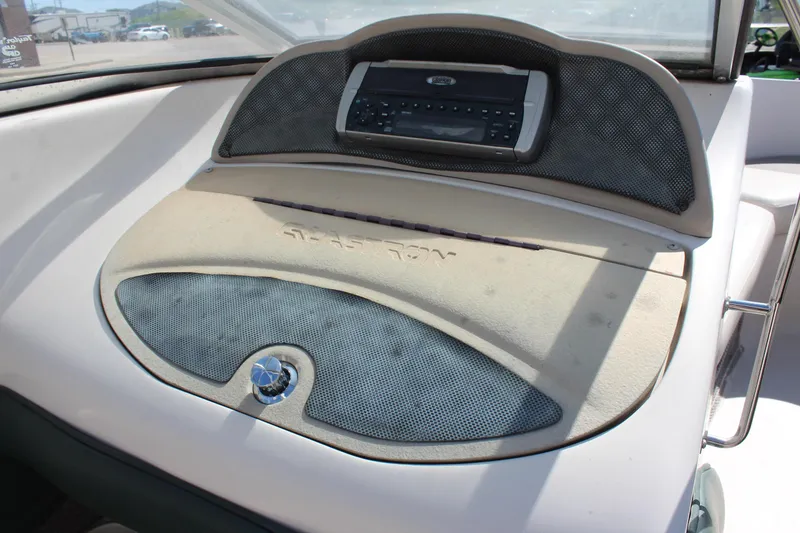 Slide: The Image of 2001 Glastron GX 185 dashboard with stereo system and speaker grille. - 25