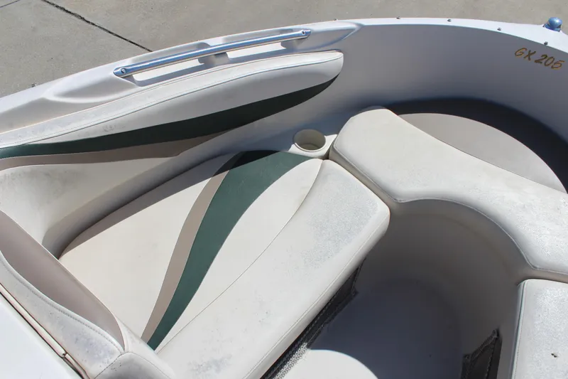 Slide: The Image of 2001 Glastron GX 185 boat interior with white and green seating. - 27