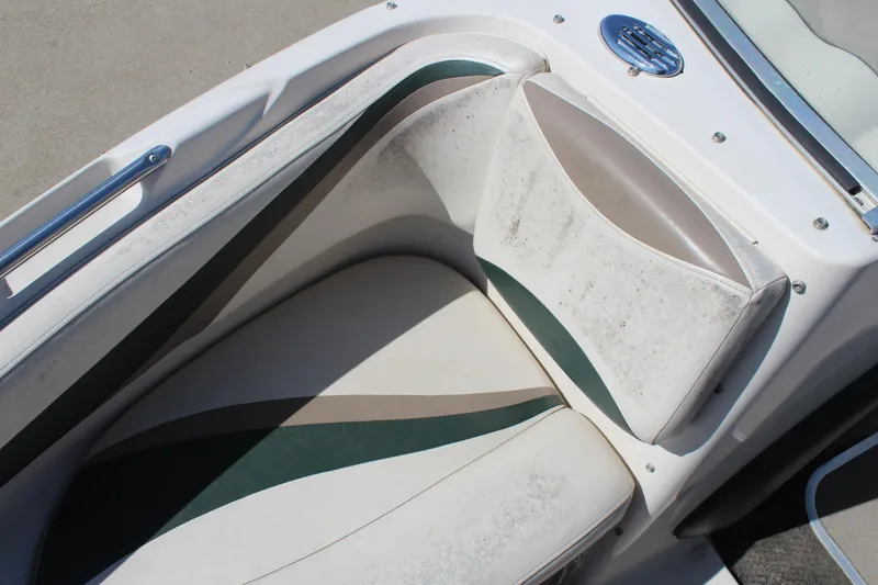 Slide: The Image of 2001 Glastron GX 185 boat interior with white and green seating. - 29