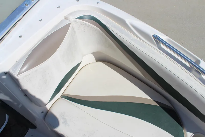 Slide: The Image of 2001 Glastron GX 185 boat seat with green and beige upholstery. - 30