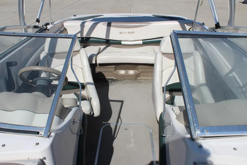 Slide: The Image of 2001 Glastron GX 185 boat interior with seating and steering wheel. - 31