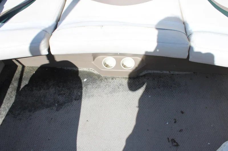 Slide: The Image of Interior of a 2001 Glastron GX 185 boat showing seating and carpeted floor. - 32