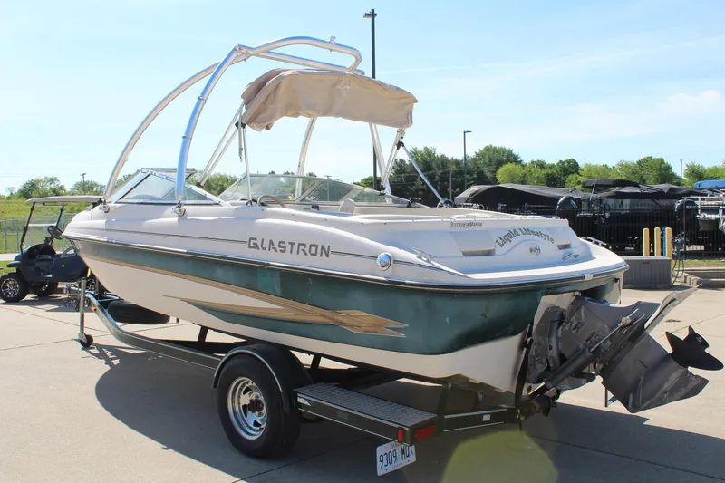Slide: The Image of 2001 Glastron GX 185 boat on trailer, parked outdoors. - 5