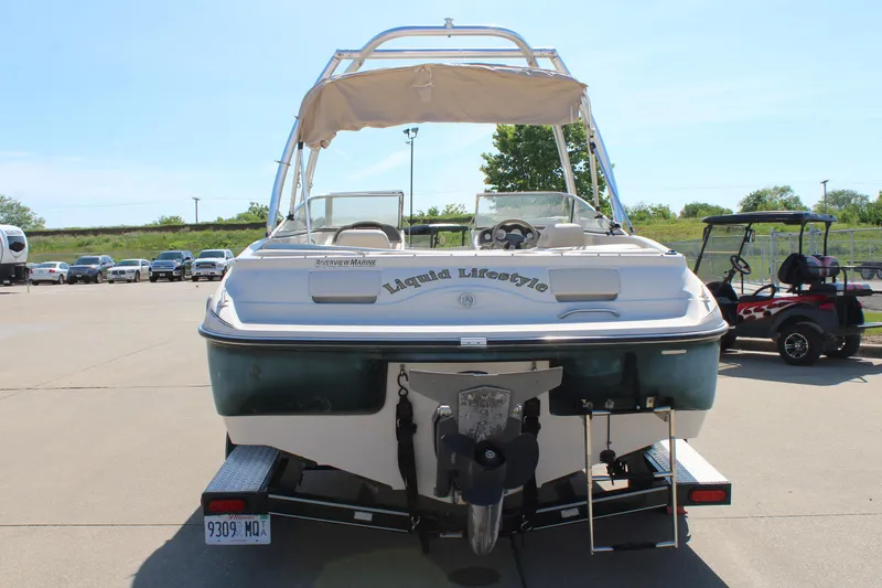 Slide: The Image of 2001 Glastron GX 185 boat on trailer, rear view, with "Liquid Lifestyle" text. - 6