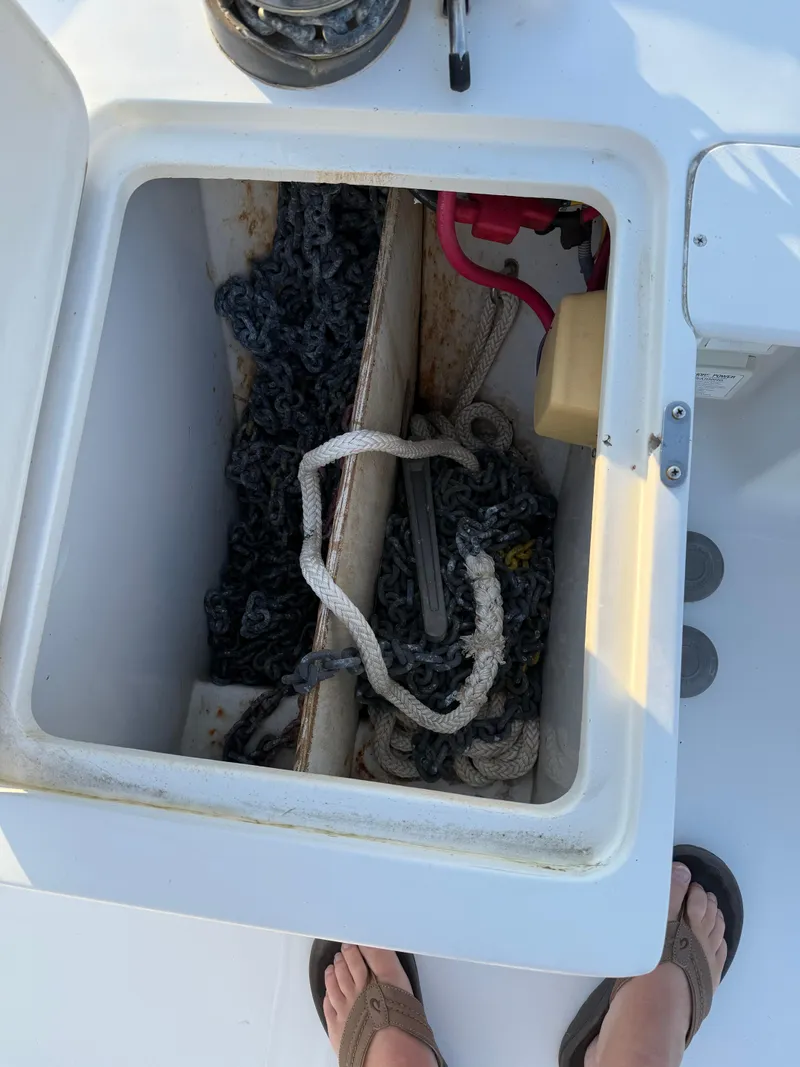 Slide: The Image of Storage compartment on a 2000 Mainship 390 Trawler with ropes and equipment. - 18