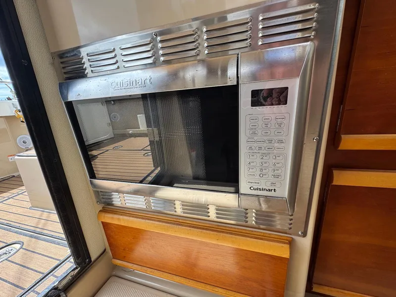 Slide: The Image of Built-in Cuisinart microwave in 2016 Cutwater C-26 boat interior. - 23
