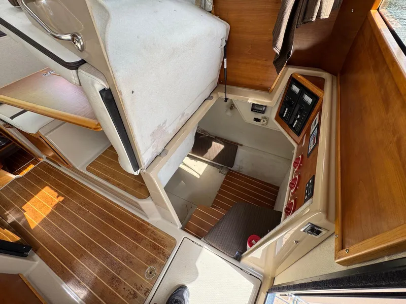 Slide: The Image of Interior view of 2016 Cutwater C-26 boat, featuring wood flooring and control panels. - 29
