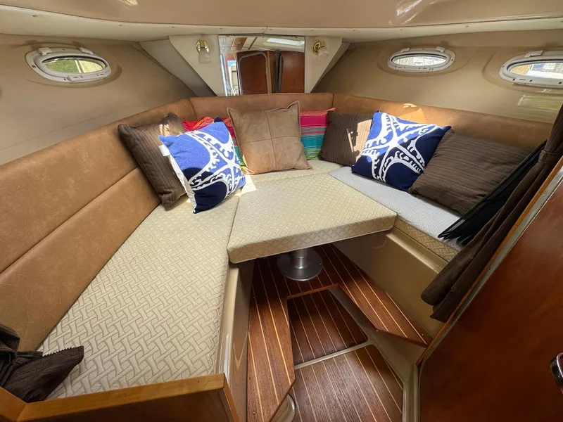 Slide: The Image of Interior of 2016 Cutwater C-26 boat with cozy seating and colorful cushions. - 32