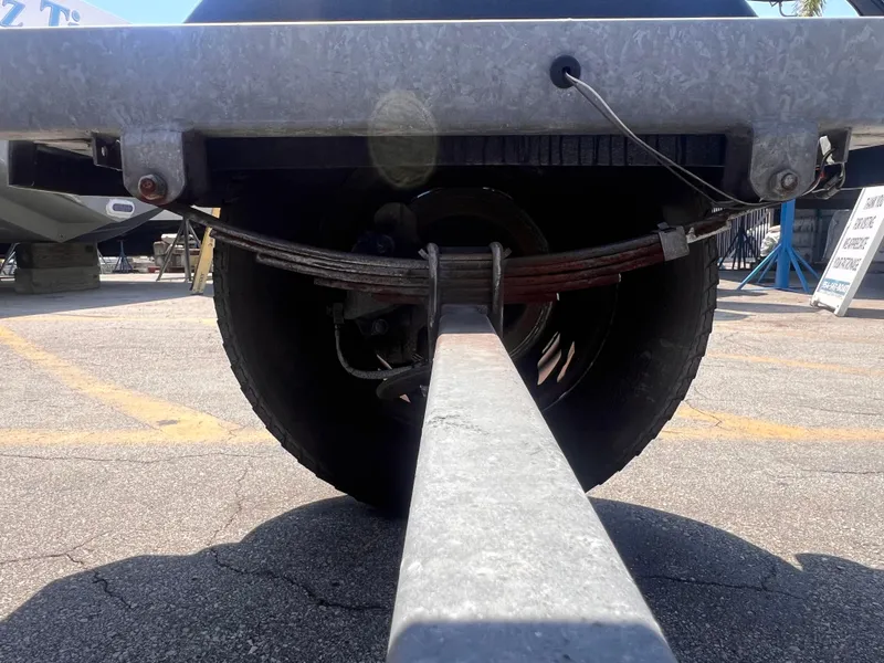 Slide: The Image of 2022 Trailer Model 19, rear view showing suspension and wheel details. - 10