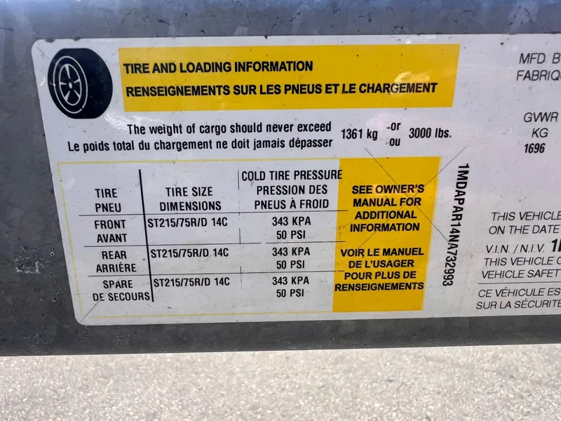 Slide: The Image of Tire and loading information label on 2022 Trailer 19, showing pressure and weight limits. - 13