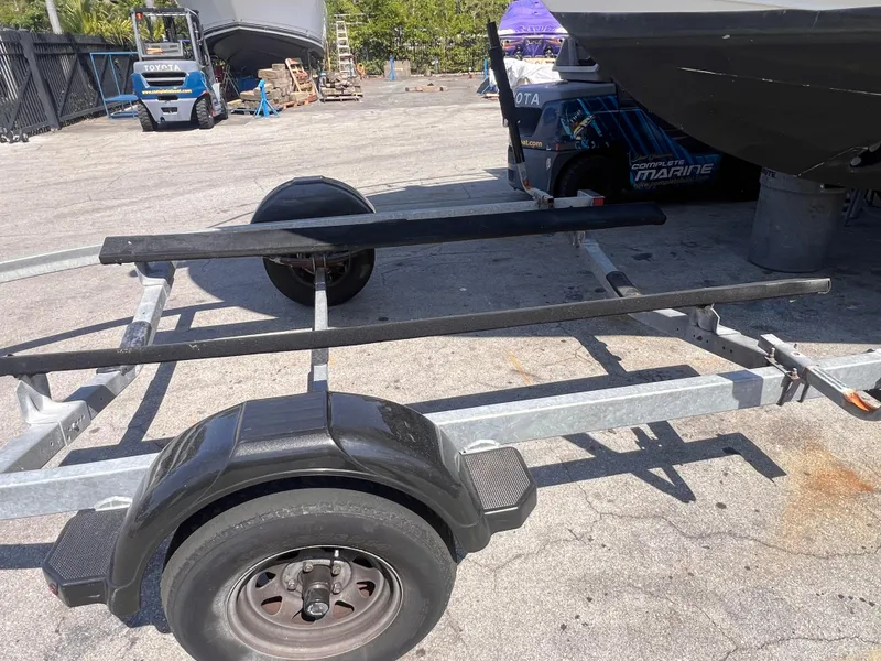 Slide: The Image of 2022 Trailer 19 model, empty, parked on concrete, with visible wheels and frame. - 6