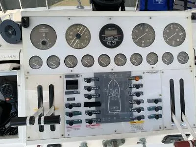 Slide: The Image of Control panel of a 1989 Trojan 12 Meter Convertible boat with gauges and switches. - 18