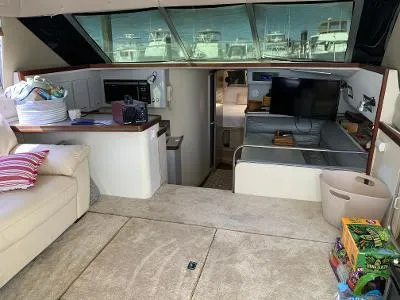 Slide: The Image of Interior of 1989 Trojan 12 Meter Convertible yacht with modern amenities and comfortable seating. - 25