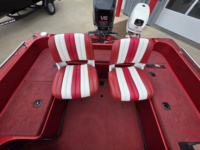 Slide: The Image of Red and white striped seats on a 1997 Ranger 692 boat deck. - 15