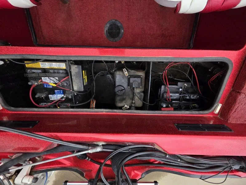 Slide: The Image of Interior view of a 1997 Ranger 692 boat showing battery compartment and wiring. - 17