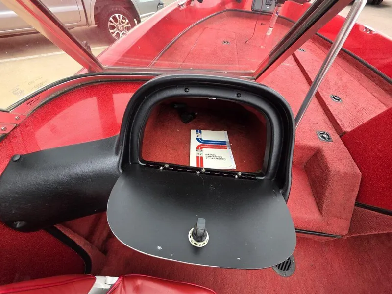 Slide: The Image of 1997 Ranger 692 boat interior with red carpet and open glove compartment. - 20