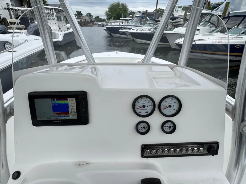 Slide: The Image of 2020 Tidewater 198 CC Adventure boat dashboard with gauges and navigation system. - 12