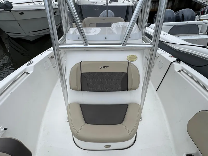 Slide: The Image of 2020 Tidewater 198 CC Adventure boat interior with seating and console. - 15