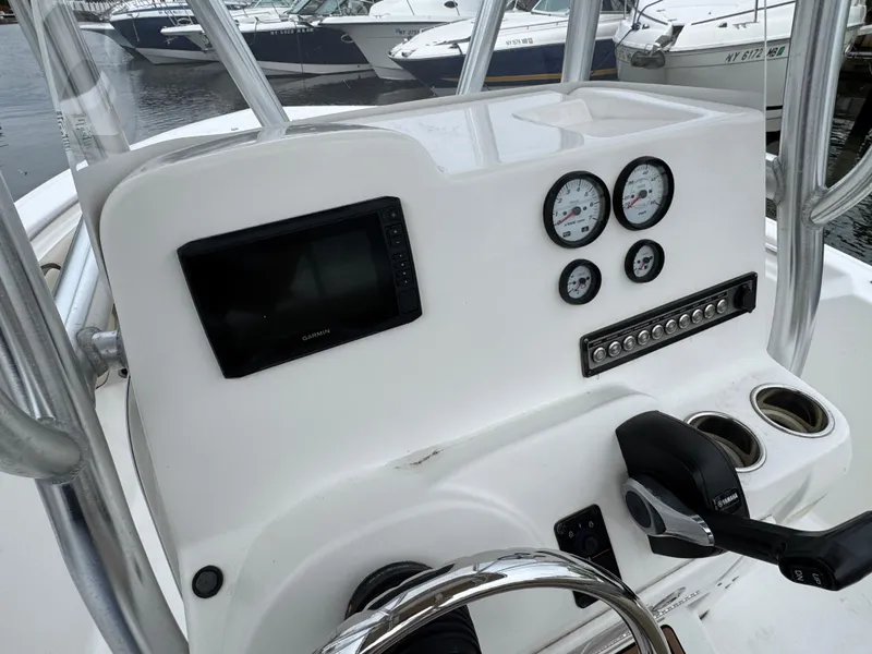 Slide: The Image of 2020 Tidewater 198 CC Adventure boat dashboard with gauges and controls. - 8