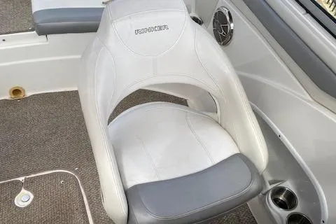 Slide: The Image of 2013 Rinker Captiva 220 MTX boat seat with white and gray upholstery. - 18