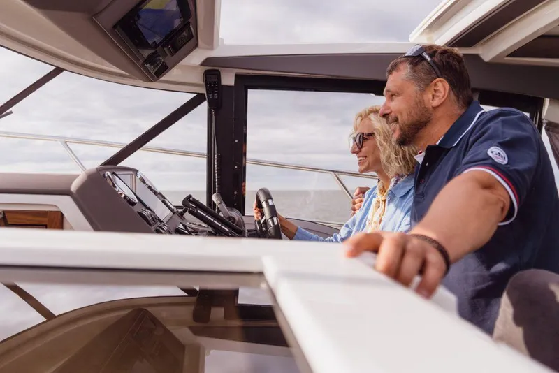 Slide: The Image of Couple enjoying a ride on a 2025 Marex 330 Scandinavia boat. - 10