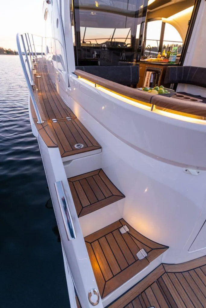 Slide: The Image of 2025 Marex 330 Scandinavia yacht with elegant teak deck and ambient lighting. - 15