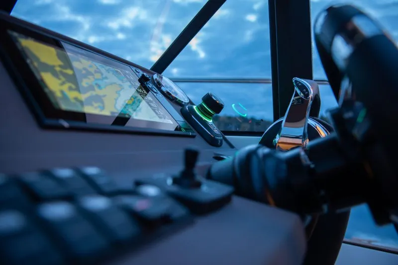 Slide: The Image of Helm of 2025 Marex 330 Scandinavia boat with navigation controls and steering wheel. - 21