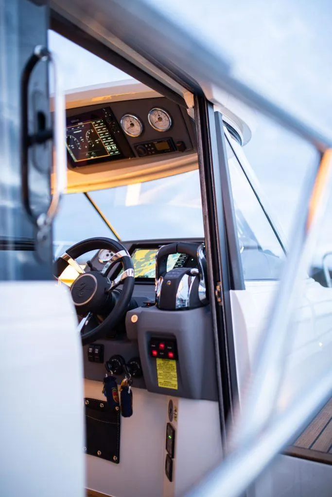 Slide: The Image of Interior view of 2025 Marex 330 Scandinavia boat cockpit with modern controls. - 22