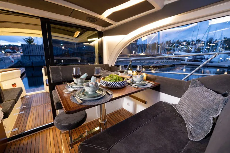 Slide: The Image of Luxurious interior of 2025 Marex 330 Scandinavia yacht with elegant dining setup. - 25
