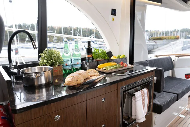 Slide: The Image of Modern kitchen interior on 2025 Marex 330 Scandinavia yacht with fresh ingredients and cookware. - 26