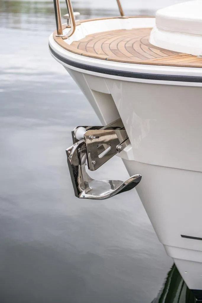 Slide: The Image of 2025 Marex 330 Scandinavia boat anchor detail on calm water. - 30
