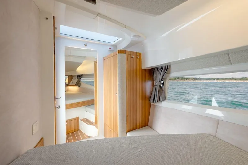 Slide: The Image of Interior of 2025 Marex 330 Scandinavia yacht with wood accents and ocean view. - 38