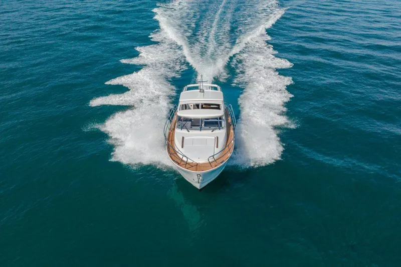 Slide: The Image of 2025 Marex 330 Scandinavia yacht cruising on open water, aerial view. - 12