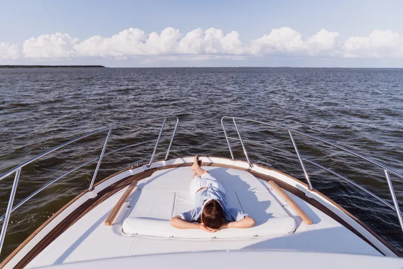 Slide: The Image of Person relaxing on the deck of a 2025 Marex 330 Scandinavia yacht at sea. - 23