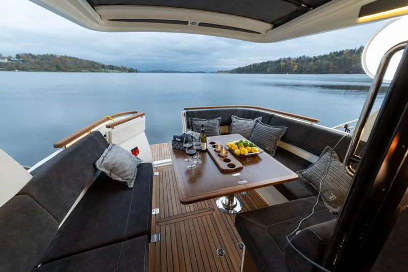 Slide: The Image of Luxurious Marex 330 Scandinavia yacht interior with elegant seating and scenic water view, 2025 model. - 5