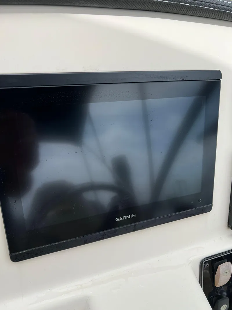 Slide: The Image of Garmin display on 2019 Grady-White Freedom 255 boat dashboard. - 25