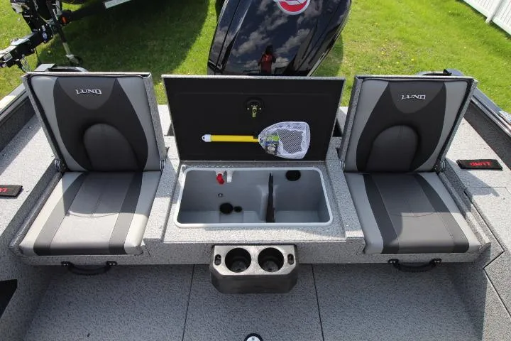 Slide: The Image of 2025 Lund 1875 Impact XS Sport boat interior with seating and storage compartments. - 2