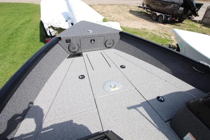 Slide: The Image of 2025 Lund 1875 Impact XS Sport boat deck with speakers and storage compartments. - 5