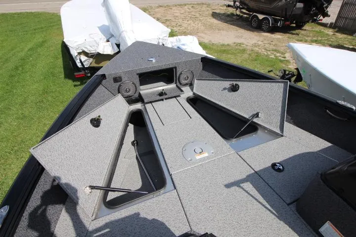 Slide: The Image of 2025 Lund 1875 Impact XS Sport boat interior with open storage compartments. - 6