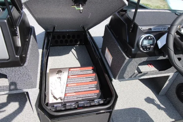 Slide: The Image of 2025 Lund 1875 Impact XS Sport boat interior with open storage compartment. - 7