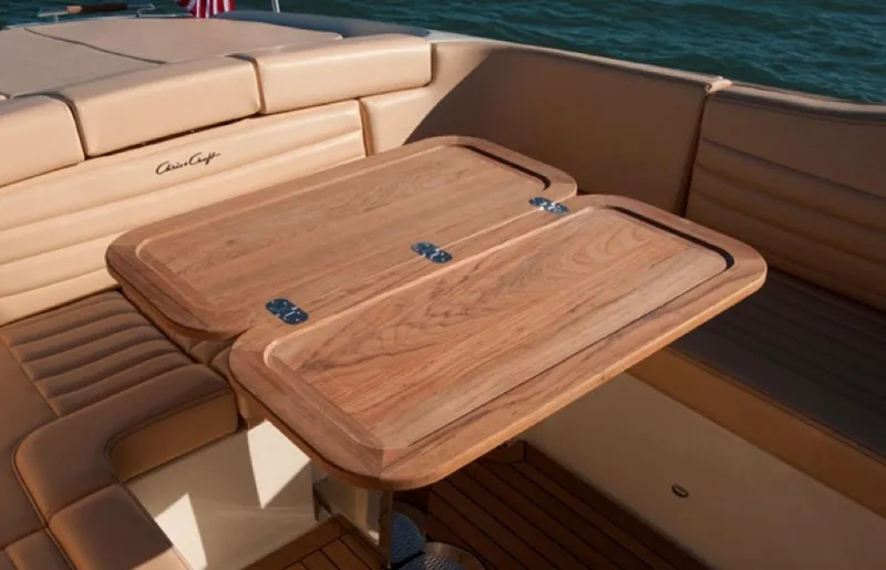 Slide: The Image of Luxurious interior of 2013 Chris-Craft Launch 32 with elegant wooden table. - 16