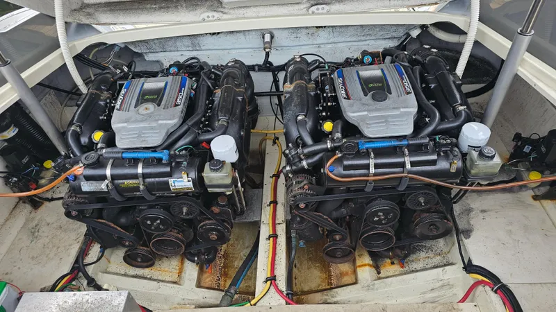 Slide: The Image of Twin engines in a 2013 Chris-Craft Launch 32 boat, showcasing detailed mechanical components. - 26