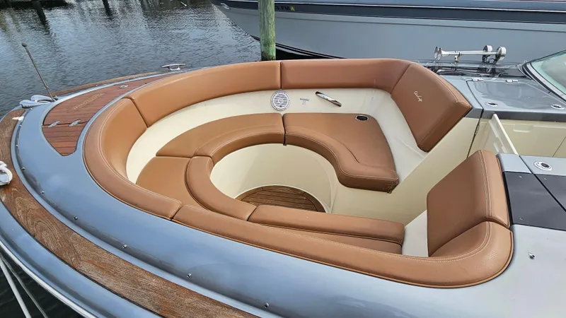 Slide: The Image of 2013 Chris-Craft Launch 32 boat with luxurious tan leather seating in the bow area. - 8